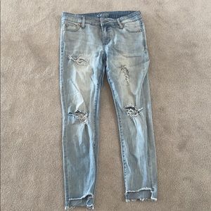 Light wash distressed denim jeans